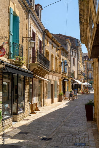 narrow street and stone archway in the historic village center of Belves