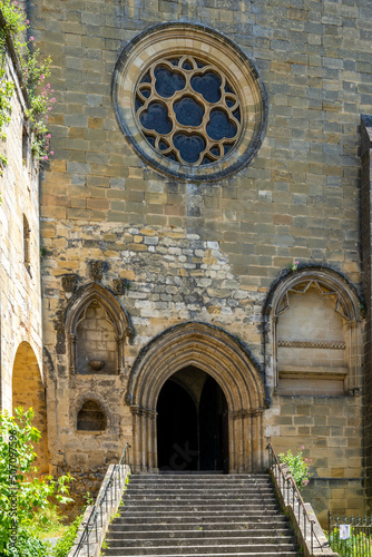 view of the Catholic church of Saint-Cyprien in the Dordogne Valley in France photo