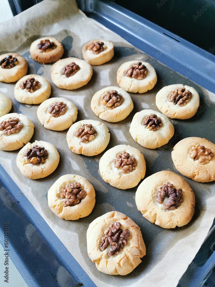 Shortbread cookies with walnuts close-up.
