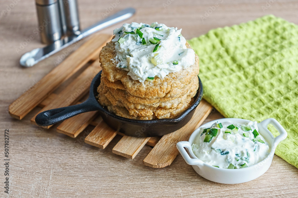 Oatmeal fritters with soft curd sauce with cucumber and herbs Oatmeal fritters with soft curd sauce with cucumber and herbs