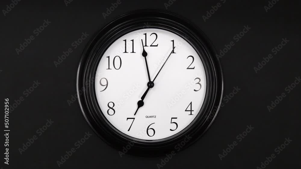 Classic Black And White Wall Clock With Black Background. Black Hands On The Clock. Timelapse. Wall Clock Face Beginning Of Time Of 7.00 Am Or Pm. 4k. ProRes. Classic Black And White Wall Clock With Black Background. Black Hands On The Clock. Timelapse. Wall Clock Face Beginning Of Time Of 7.00 Am Or Pm. 4k. ProRes.