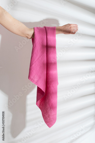pink linen fabric on the woman hand