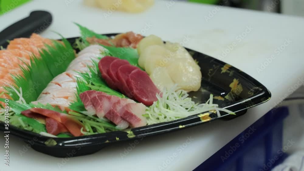 Japanese chef is making a sushi platter Japanese chef is making a sushi platter