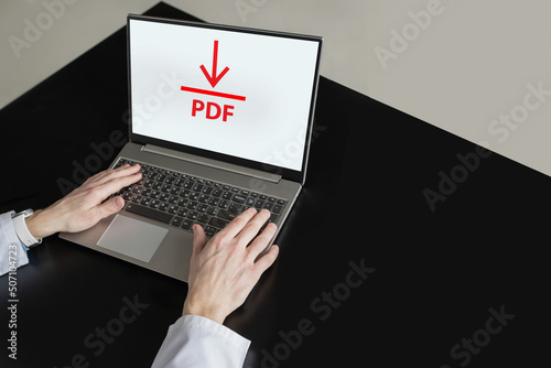 Obraz na plátně Office manager uploads PDF file to laptop, computer display with arrow and PDF i