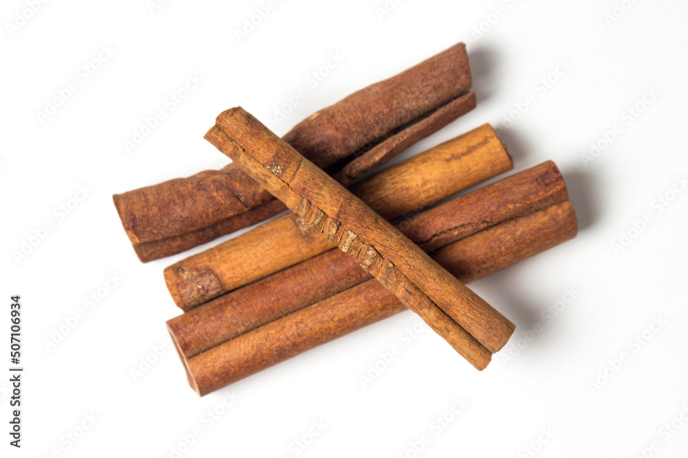 Cinnamon sticks isolated on white background. Delicious and fragrant spice.