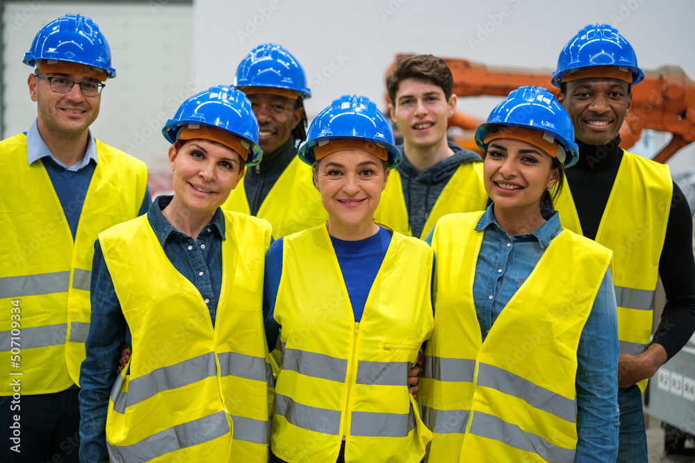 Group of engineers in factory working together Group of engineers in factory working together