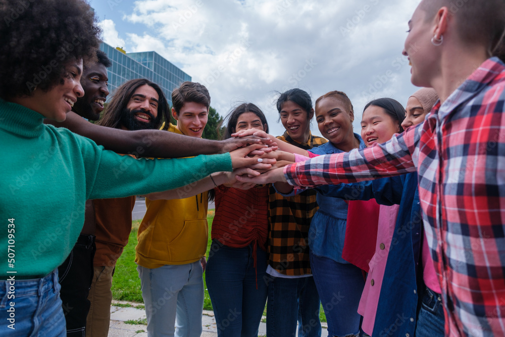 group of young people of various ethnicities having a good time group of young people of various ethnicities having a good time