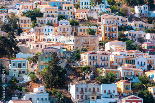 View of traditional colorful houses on Symi island, Greece, Dodecanese © LALSSTOCK