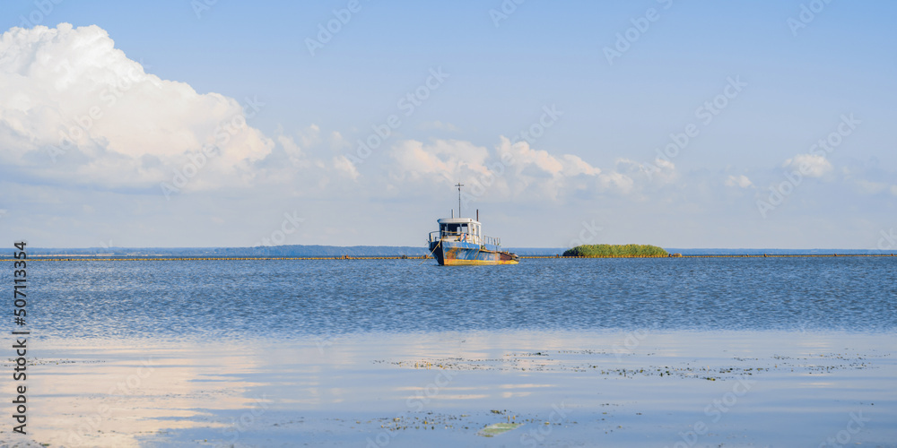 fishing boat near the coast of the Baltic Sea on a sunny day