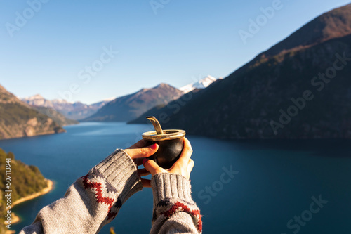 Young woman enjoying some delicious classic mates from Argentina in Patagonia. photo
