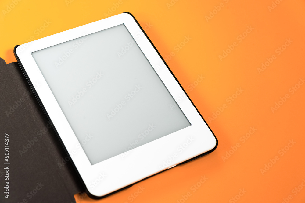 Ebook reader over yellow background Ebook reader over yellow background