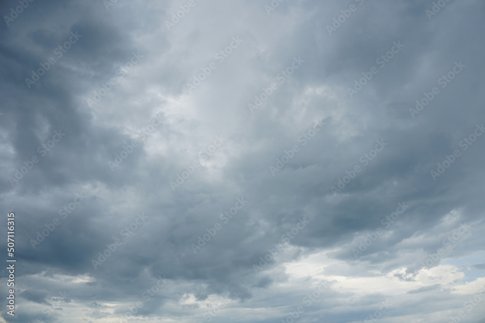 Nimbostratus clouds are dark, grey, featureless layers of clouds situated low in the sky.