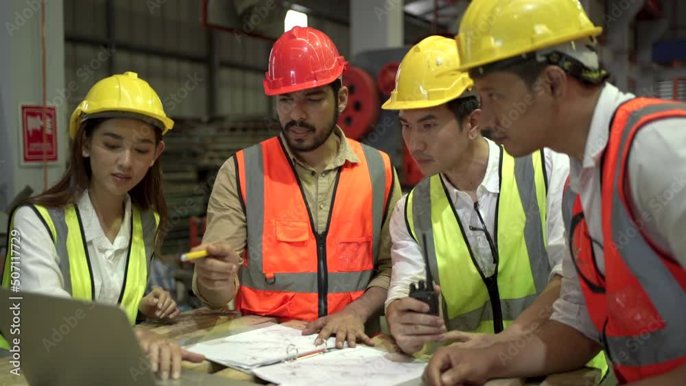 Industrial or mechanical engineers planning together. Industrial or mechanical engineers planning together.
