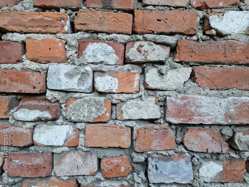 A fragment of an old brick wall in the city center of Lodz.