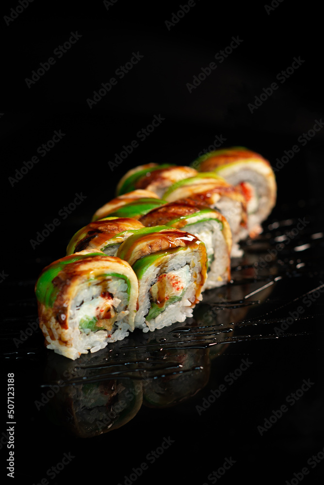 Sushi appetizing on black glossy background roll Sushi appetizing on black glossy background roll