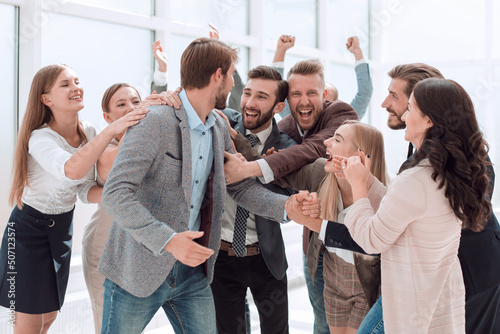 happy business team applauding the leader of a successful projec