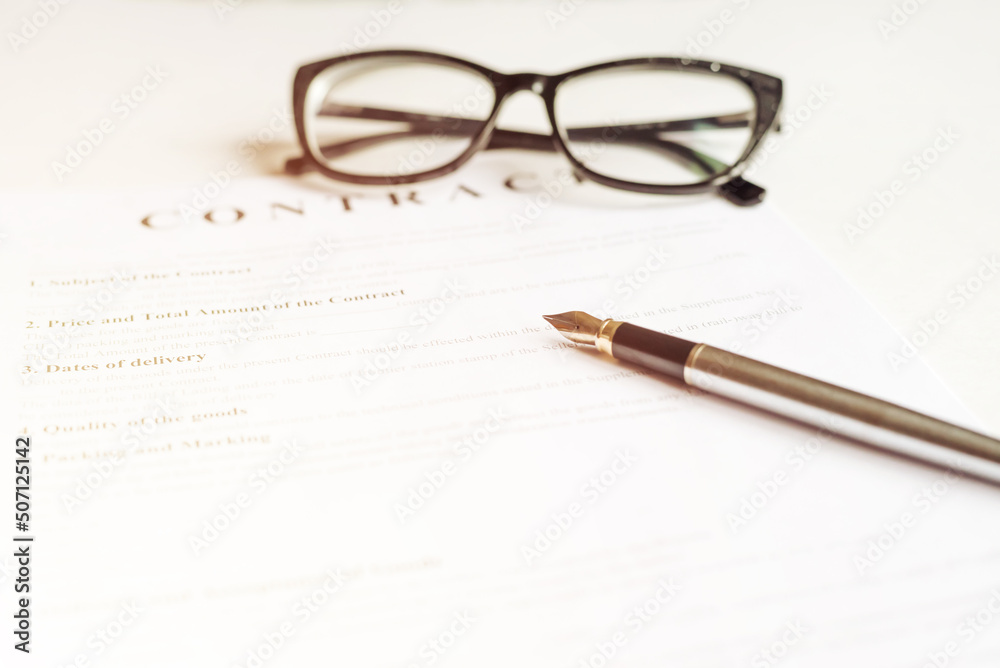 office desk with signing contract, glasses and pen for business top view office desk with signing contract, glasses and pen for business top view
