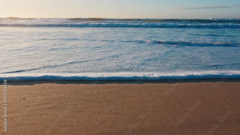 Beach in Brazil. Sandy beach with gentle foamy wave rolling over the coast at sunrise. Campeche town on the island of Santa Catarina in Brazil, Atlantic Ocean Beach in Brazil. Sandy beach with gentle foamy wave rolling over the coast at sunrise. Campeche town on the island of Santa Catarina in Brazil, Atlantic Ocean