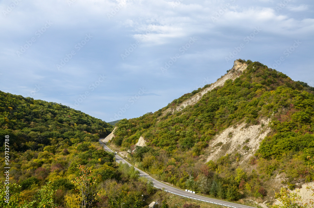 Autumn View to road to Gombori pass and Caucasian mountains covered forest from Medieval Ujarma fortress in Kakheti region of Georgia