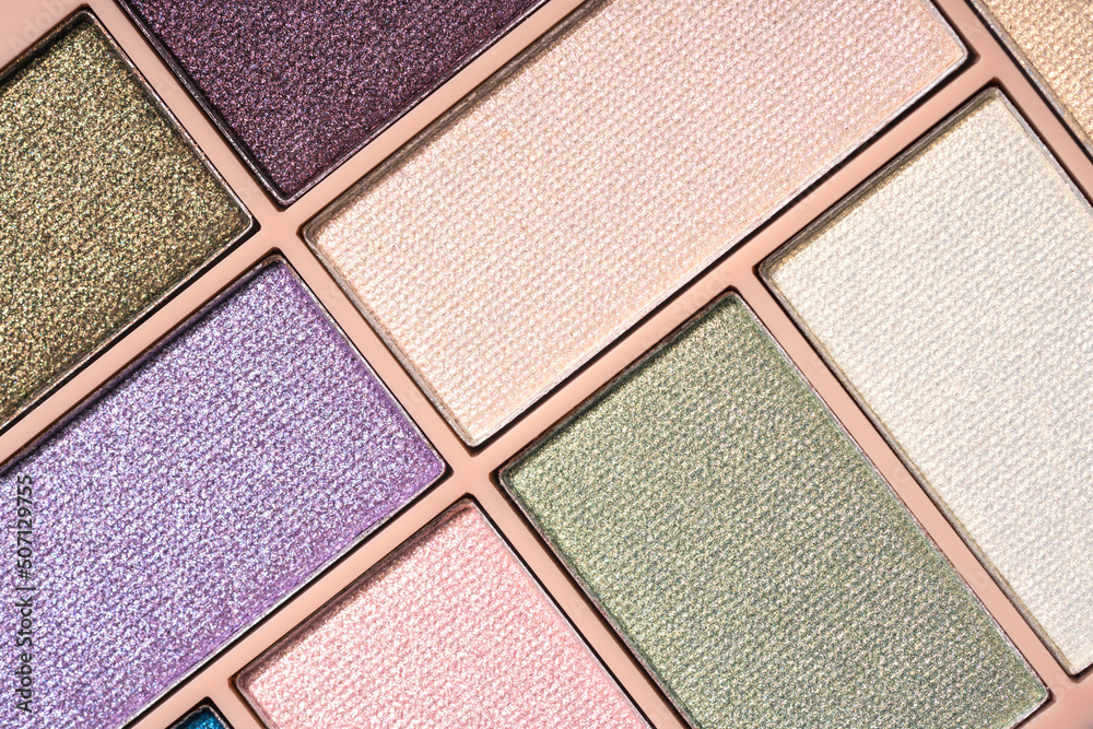 Fototapeta premium Glitter eyeshadows palette for festive makeup as background. Professional make up and beauty concept, flat lay