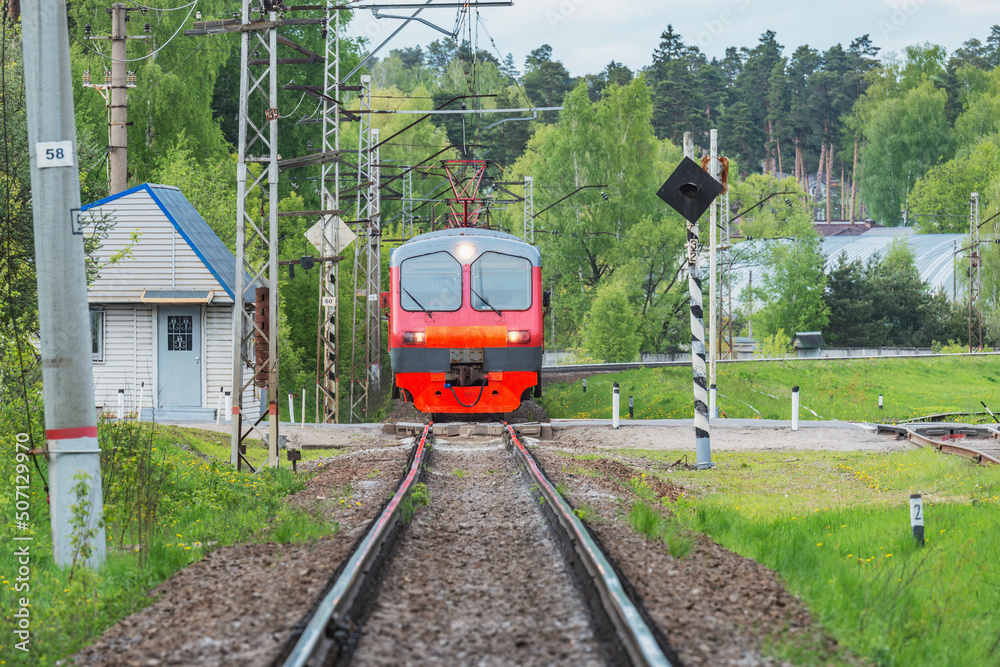 Naklejka premium Local passenger train approaches to the station.