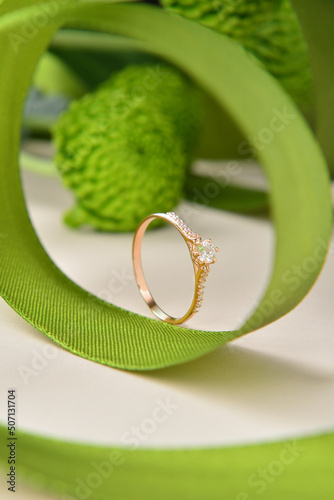 Golden ring wits flowers and ribbons
