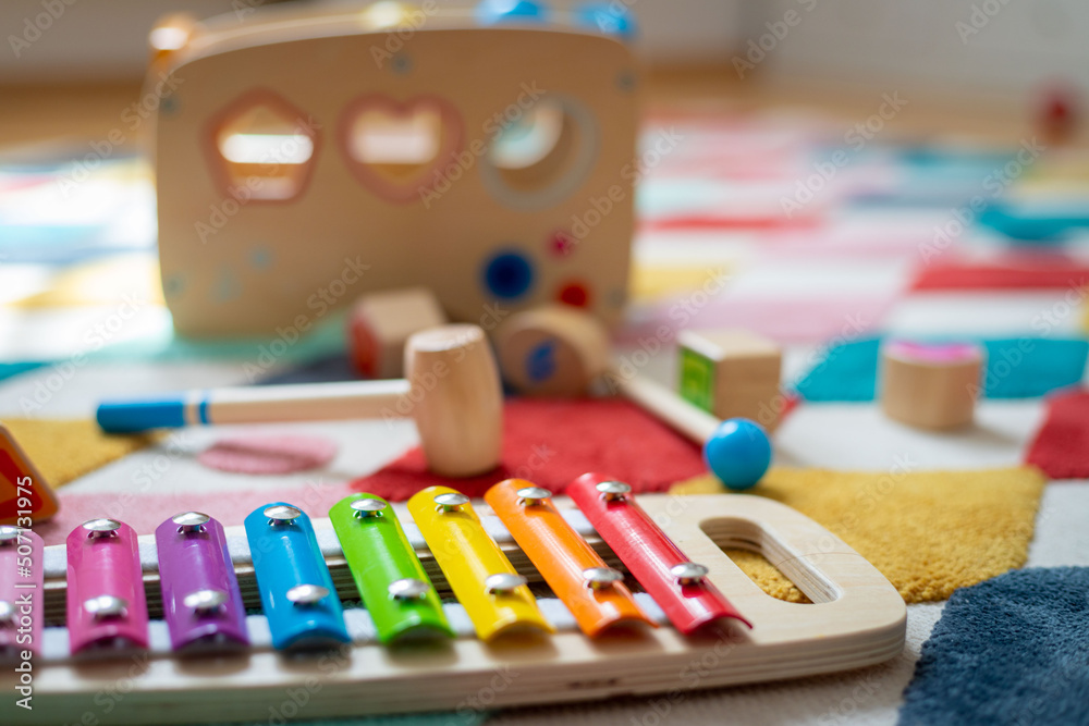 Young child toy concept: Close up of stylish wooden toddler toy in nursery Young child toy concept: Close up of stylish wooden toddler toy in nursery