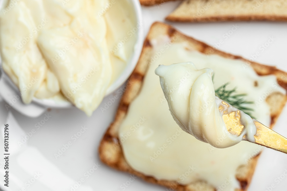 Fresh sandwich with cream cheese and butter for breakfast. melted cheese sandwich on light background. Food recipe background. Close up Fresh sandwich with cream cheese and butter for breakfast. melted cheese sandwich on light background. Food recipe background. Close up