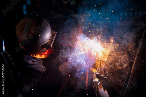 Welding steel structures and bright sparks in steel construction industry. © nuttawutnuy