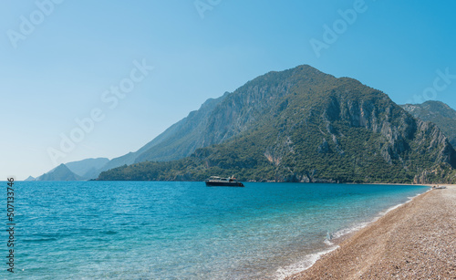 beautiful clouds and mountains next to the sea. seascape. coast of Turkey and the city of Chirali. photo