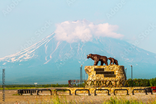  Monument She bear with the cub on the background of the Koryaksky Volcano, Kamchatka, Russia photo