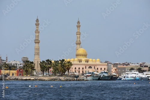View of the coastline with the Mosque El Mina Masjid, yachts and buildings, in New Marina in Hurghada, Egypt.