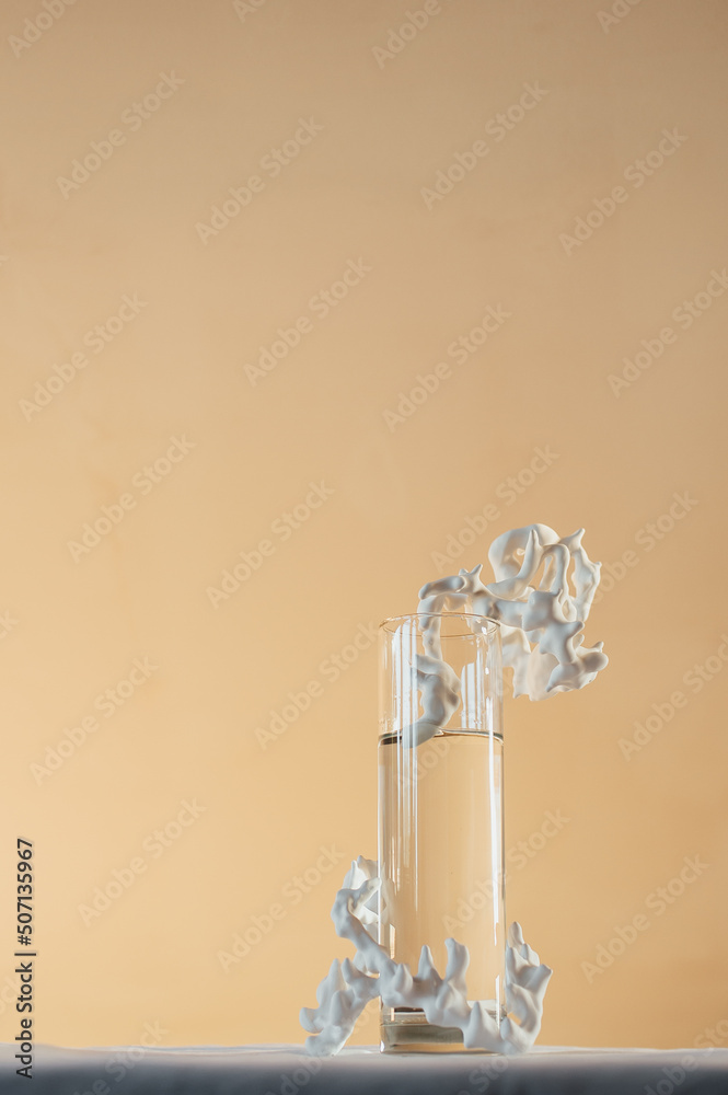 vertical shot, glass vase with flowers on the table, pastel colors