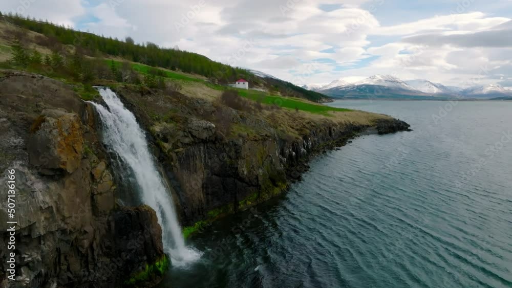 Aerial view of the waterfall from the hot river spring near the town of Akureyri in North Iceland. Aerial view of the waterfall from the hot river spring near the town of Akureyri in North Iceland.