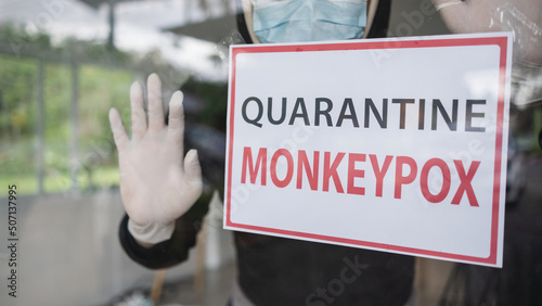 Monkeypox outbreak concept. Message paper quarantine to home isolation during monkeypox virus epidemic. photo