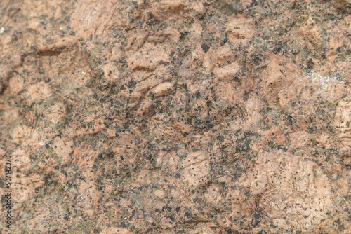 Texture of red granite. Rough structured surface. background design.