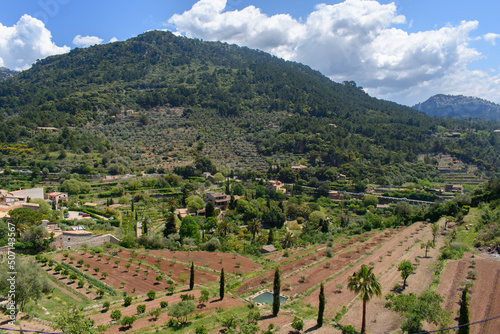 View of mountain and gardens in Valldemossa, Mallorca, Spain. Village in the valley surrounded by mountains.