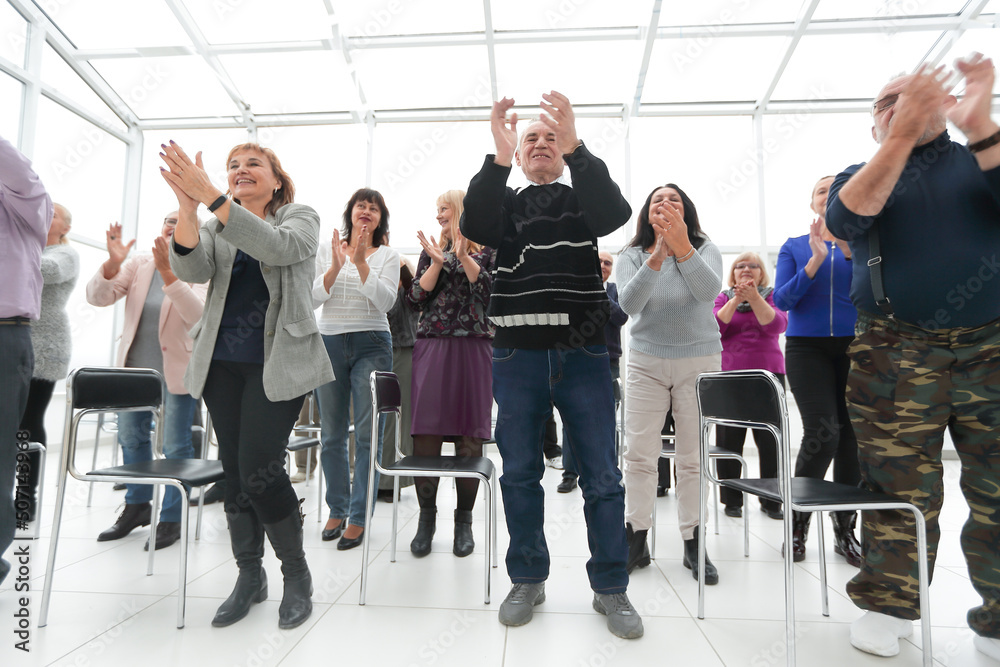 Fototapeta premium group of mature people applauding after meeting
