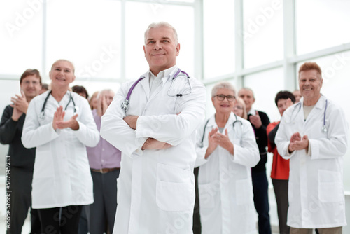 group of doctors and patients applaud