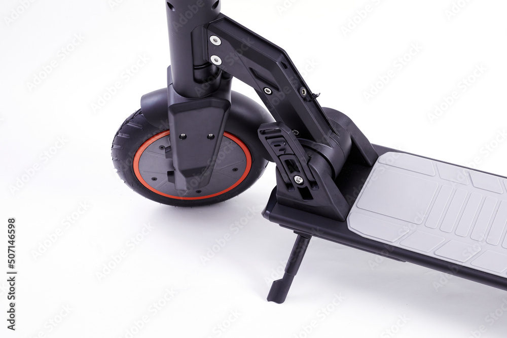 Electric wheel on a white studio background. Wheel from electric scooter. Modern city transport for people and bussinesman. Electric wheel on a white studio background. Wheel from electric scooter. Modern city transport for people and bussinesman.