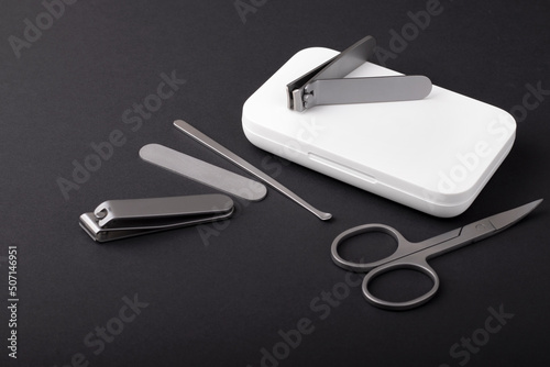 Manicure set with a cover on a black background