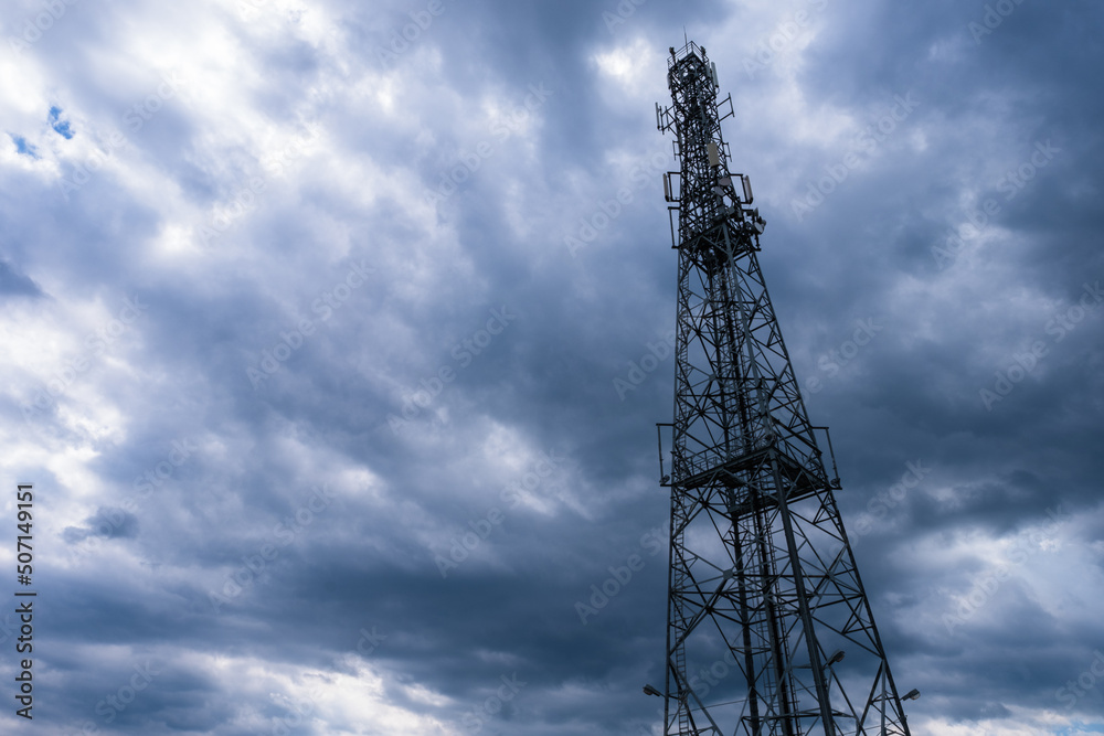 Telecommunication tower with cloudy sky Telecommunication tower with cloudy sky