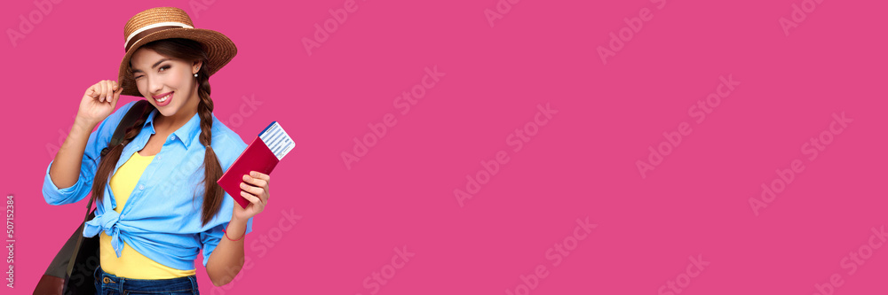 © khmelev - Smiling woman traveler in straw hat and backpack holding passport with plane ticket over pink isolate background