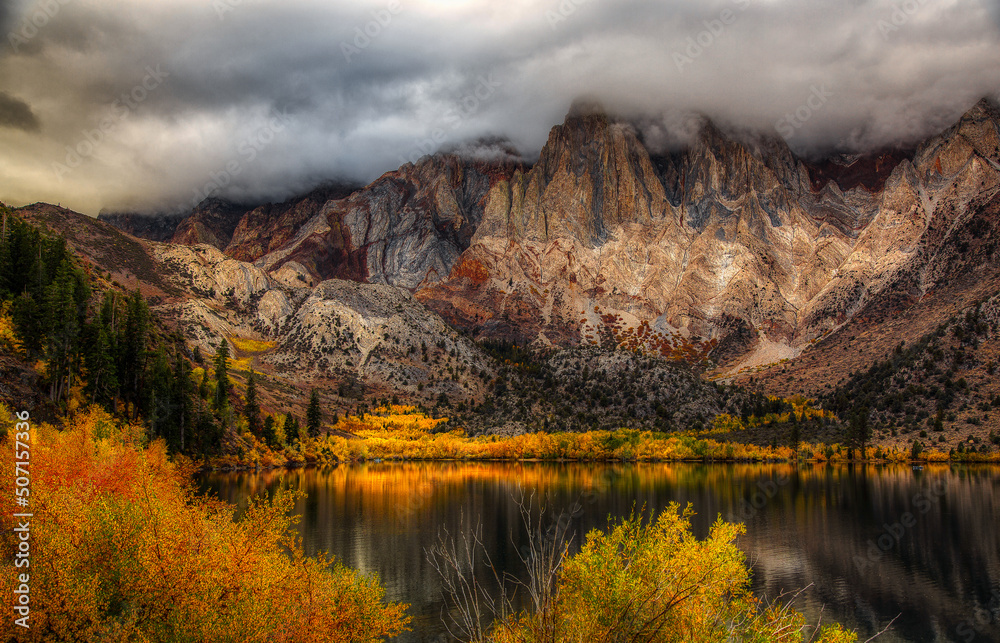 June lake in the fall with clouds and mist