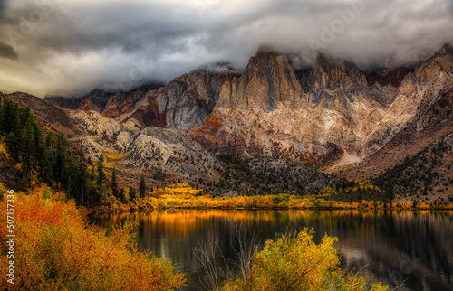 June lake in the fall with clouds and mist