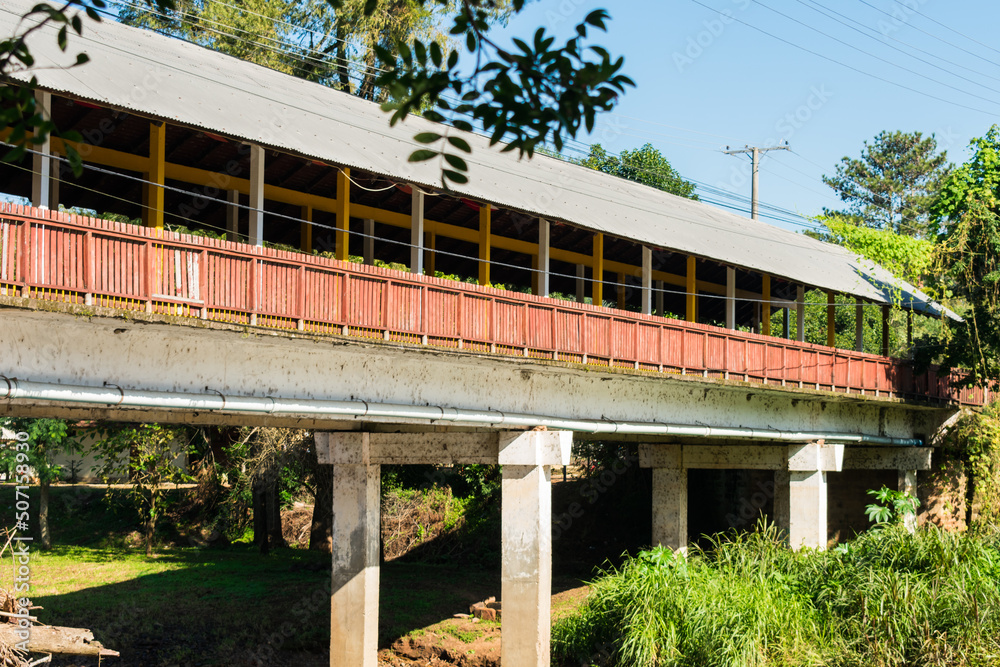 Paranhana river and a view of the covered bridge - a historical landmark in Tres Coroas, Brazil Paranhana river and a view of the covered bridge - a historical landmark in Tres Coroas, Brazil