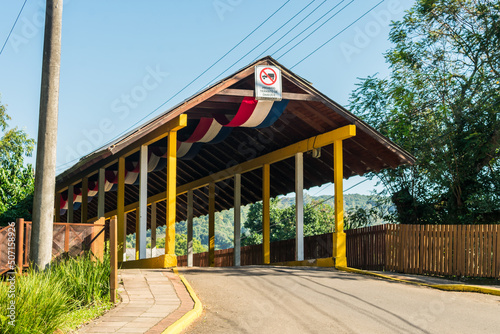 Entrance of the covered bridge - a historical landmark in Tres Coroas, Brazil photo