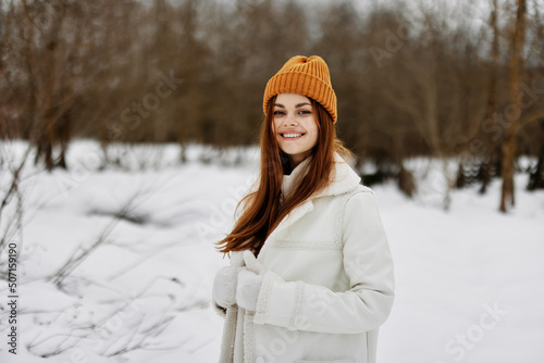 portrait of a woman in winter clothes in a hat fun winter landscape winter holidays