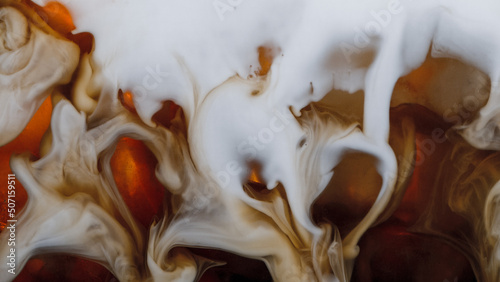 Fototapeta Naklejka Na Ścianę i Meble -  Super Slow Motion Shot of Pouring Cream into Ice Coffee, Close-up
