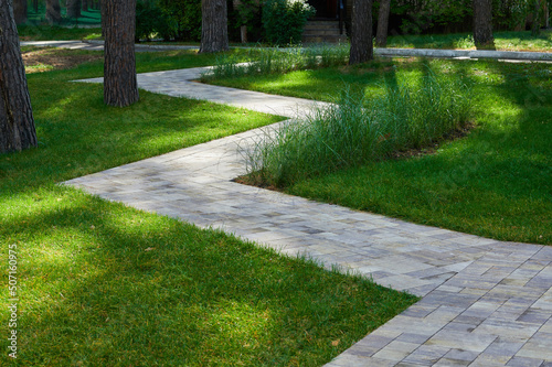 stone walkway in landscape design surrounded